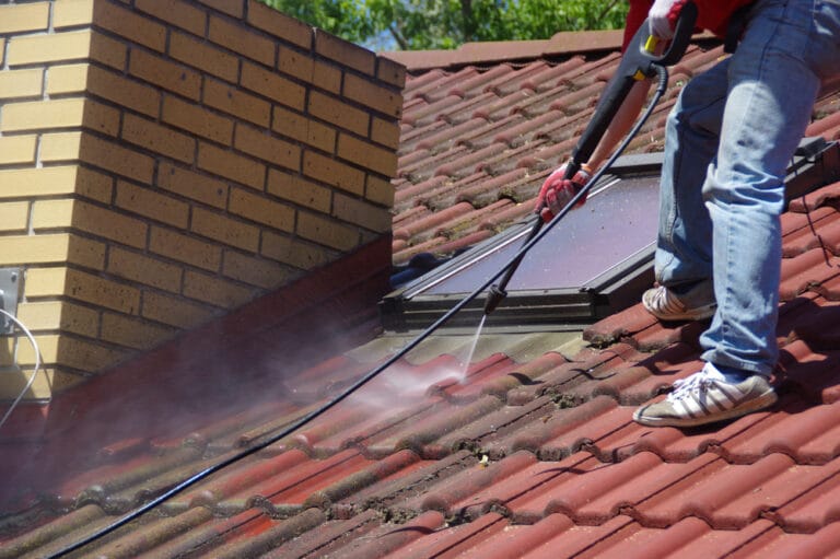 Professional roof services including cleaning, repairs, and painting on a residential property across Scotland